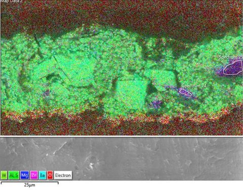 Colour photograph. An image with the appearance of a scientific study, showing passages of textural red, purple and green surface. In the lower right, two purple areas have been circled in white, and read ‘Spectrum 24, and ‘Spectrum 25’. In the top left, the words ‘Map Data 2’ can just be seen.